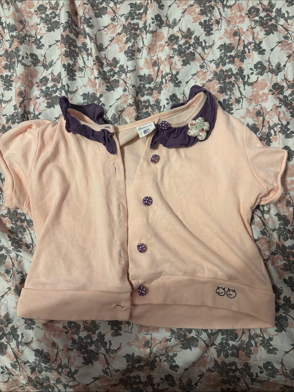 Cropped Girls Pink Short-Sleeve Top or Cardigawith Purple Trim and Flower Accent